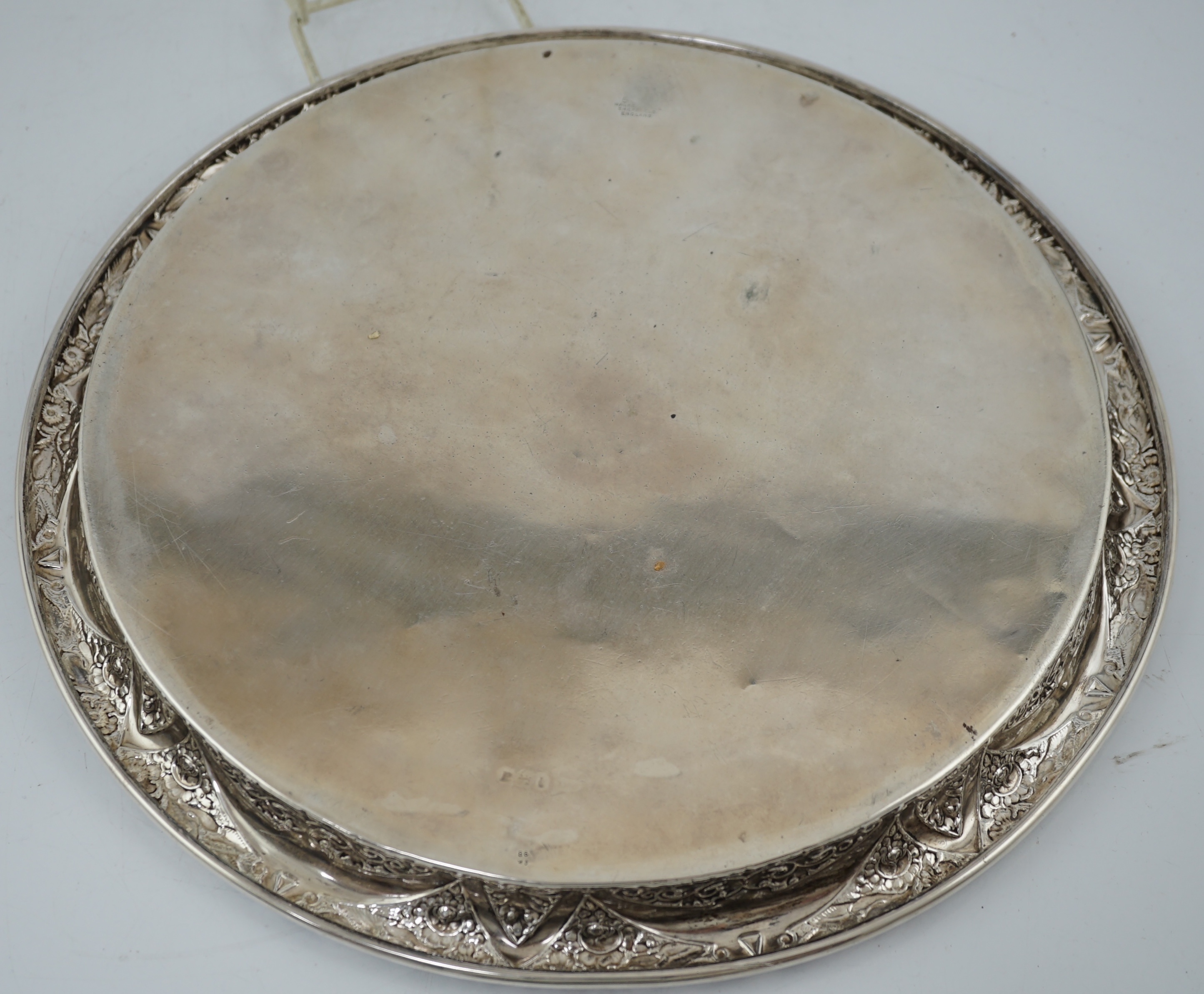 A George V silver circular tray, by Walker & Hall